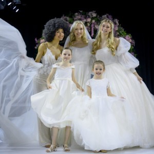 Press Page - Image of 3 brides with 2 flower girls on Catwalk