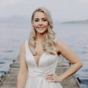 Bride posing with flowers