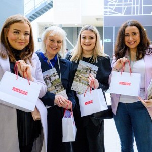 Press Page - Image of VIP visitors with Clarins goody bags