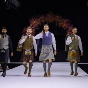 Press Page - Image of 4 x grooms in kilts on Catwalk